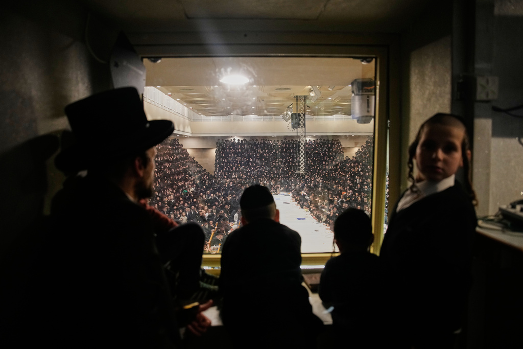 Ultra-Orthodox Jews from the Belz Hasidic dynasty celebrate the Jewish holiday of Tu Bishvat, the "New Year of the Trees," in Jerusalem, Monday, Feb. 2, 2026. (AP Photo/Ohad Zwigenberg)