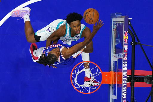 Charlotte Hornets' Collin Sexton, top, goes up for a shot against Philadelphia 76ers' Jabari Walker during the first half of an NBA basketball game Saturday, Oct. 25, 2025, in Philadelphia. (AP Photo/Matt Slocum) Charlotte Hornets' Collin Sexton, top, goes up for a shot against Philadelphia 76ers' Jabari Walker during the first half of an NBA basketball game Saturday, Oct. 25, 2025, in Philadelphia. (AP Photo/Matt Slocum)