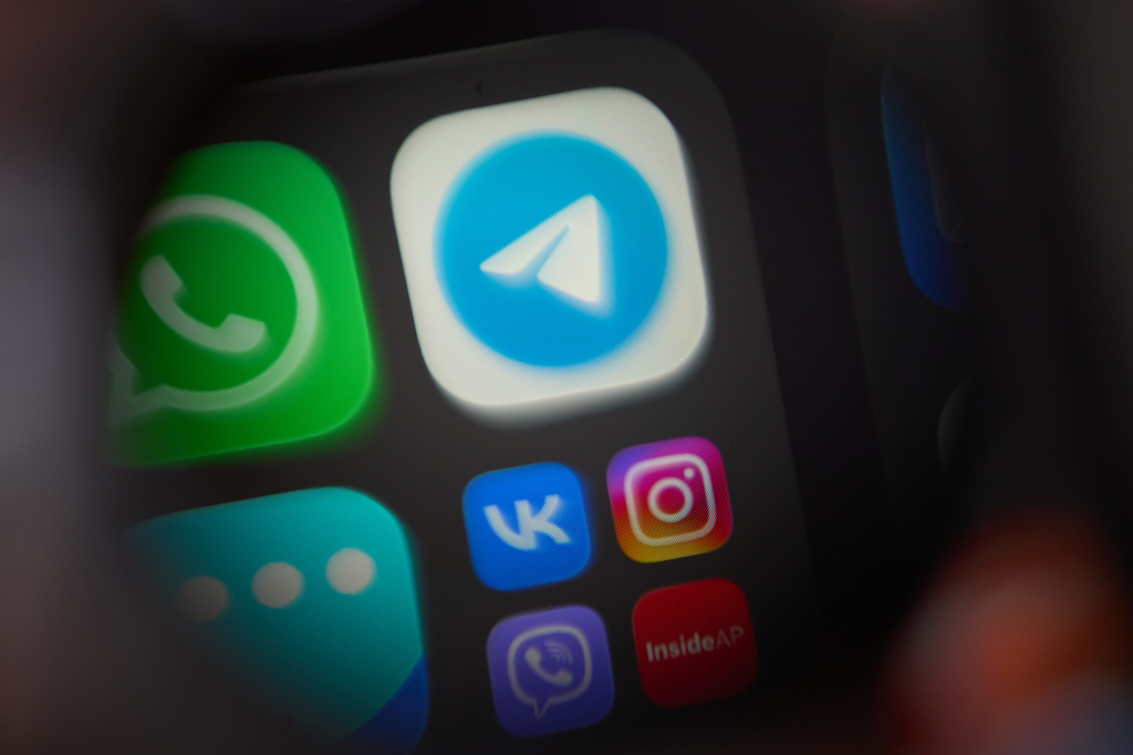 The app Telegram, center, a popular messenger app in Russia restricted by authorities, is shown on a smartphone in Moscow, Russia, Wednesday, July 29, 2026. (AP Photo)