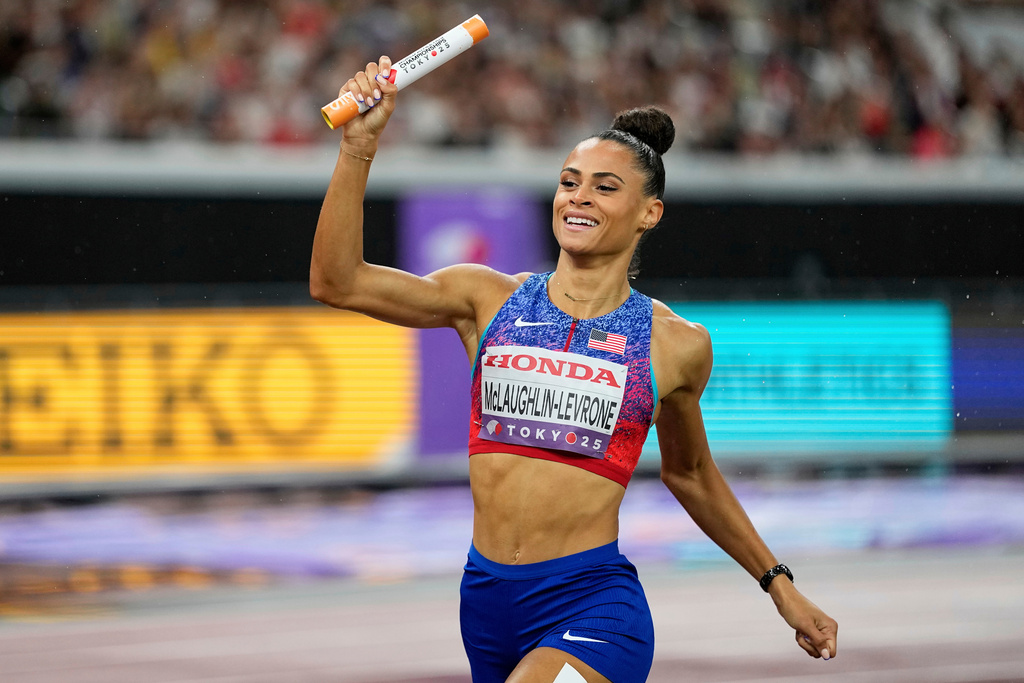 FILE - Sydney McLaughlin-Levrone crosses the finish line to win the women's 4 X 400 meters relay at the World Athletics Championships in Tokyo, Sept. 21, 2025. (AP Photo/Matthias Schrader, File)