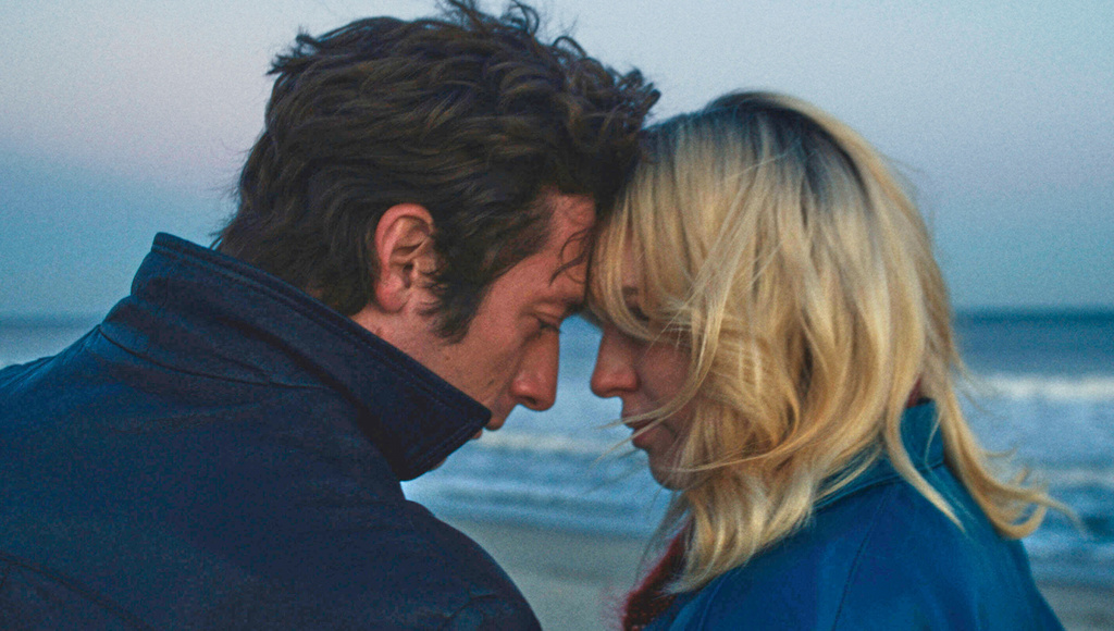 This image released by Disney shows Jeremy Allen White as Bruce Springsteen, left, and and Odessa Young as Faye, in a scene from "Springsteen: Deliver Me From Nowhere." (20th Century Studios via AP)