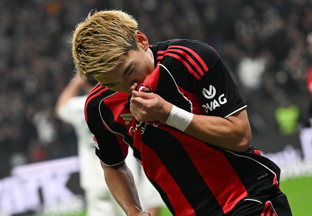 Frankfurt's Ritsu Doan celebrates after scoring during the German Bundesliga soccer match between Eintracht Frankfurt and FSV Mainz 05 in Frankfurt, Germany, Sunday, Nov. 9, 2025. (Arne Dedert/dpa via AP)