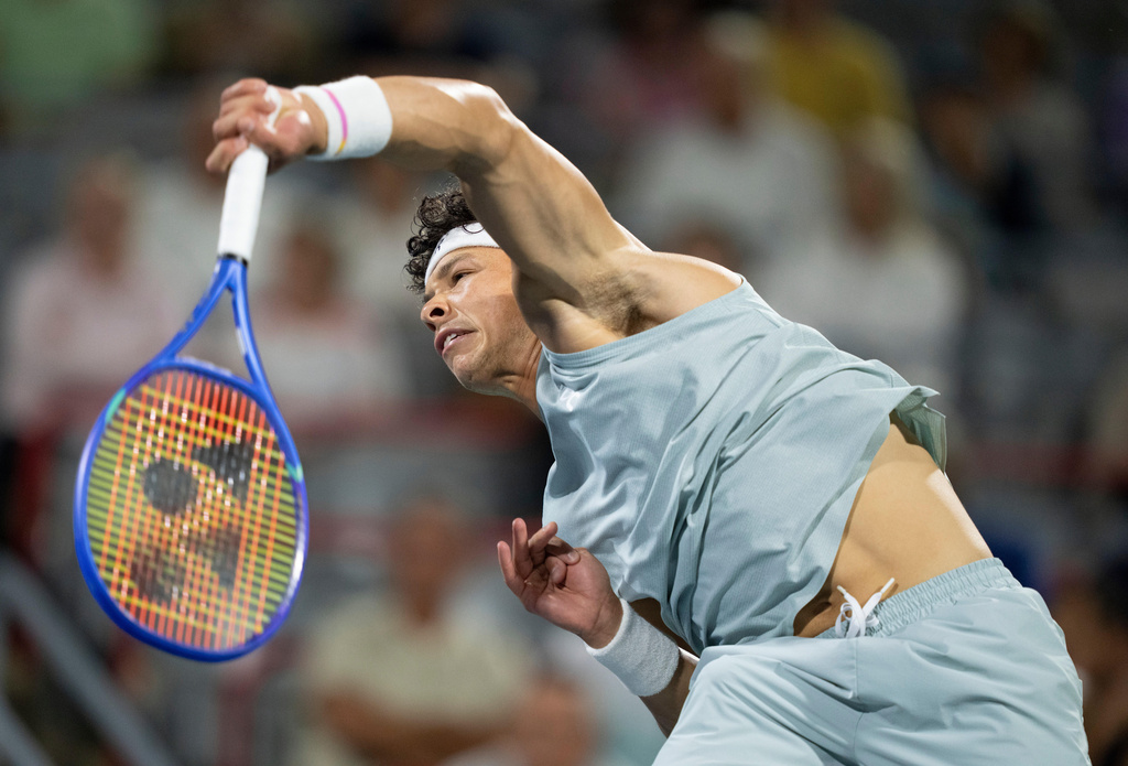 Ben Shelton of the United States serves to his compatriot Learner Tien during a semifinal tennis match at the National Bank Open in Montreal on Wednesday, Aug. 12, 2026. (Christinne Muschi/The Canadian Press via AP)