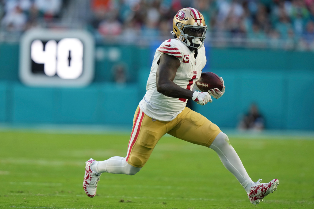 FILE - San Francisco 49ers wide receiver Deebo Samuel Sr. (1) runs for a first down during the first half of an NFL football game against the Miami Dolphins, Dec. 22, 2024, in Miami Gardens, Fla. (AP Photo/Lynne Sladky, File)