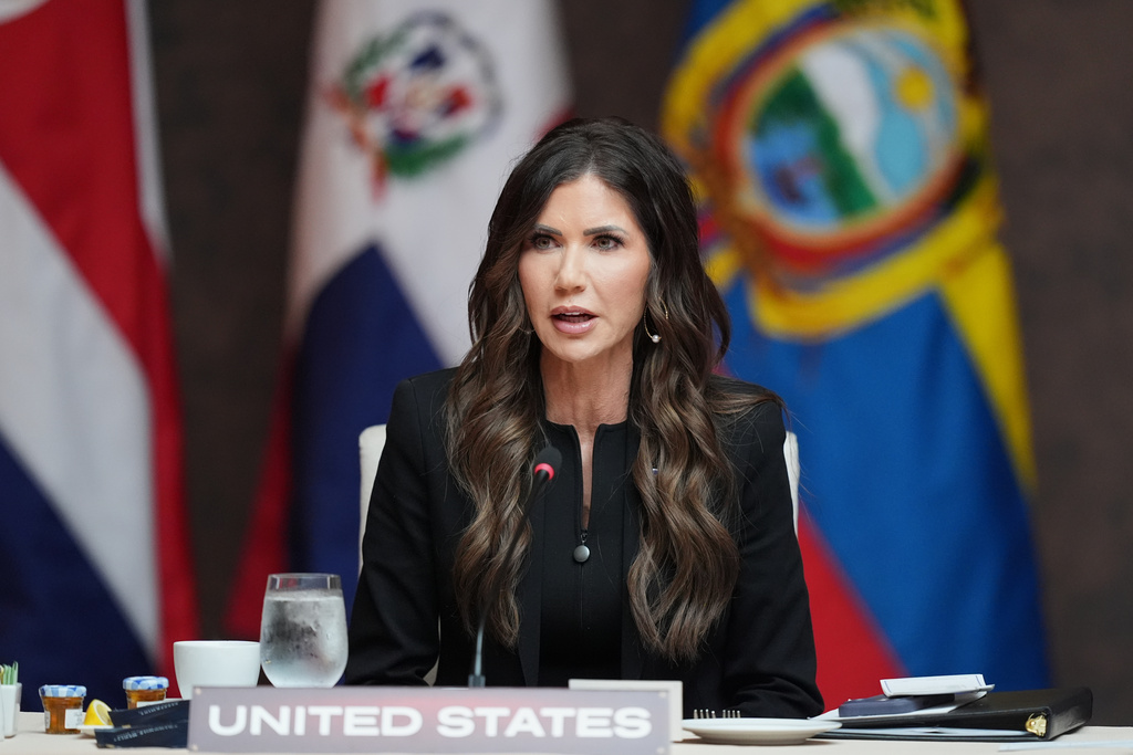 Secretary of Homeland Security Kristi Noem delivers remarks at a working lunch at the Shield of the Americas Summit, Saturday, March 7, 2026, at Trump National Doral Miami in Doral, Fla. (AP Photo/Rebecca Blackwell)