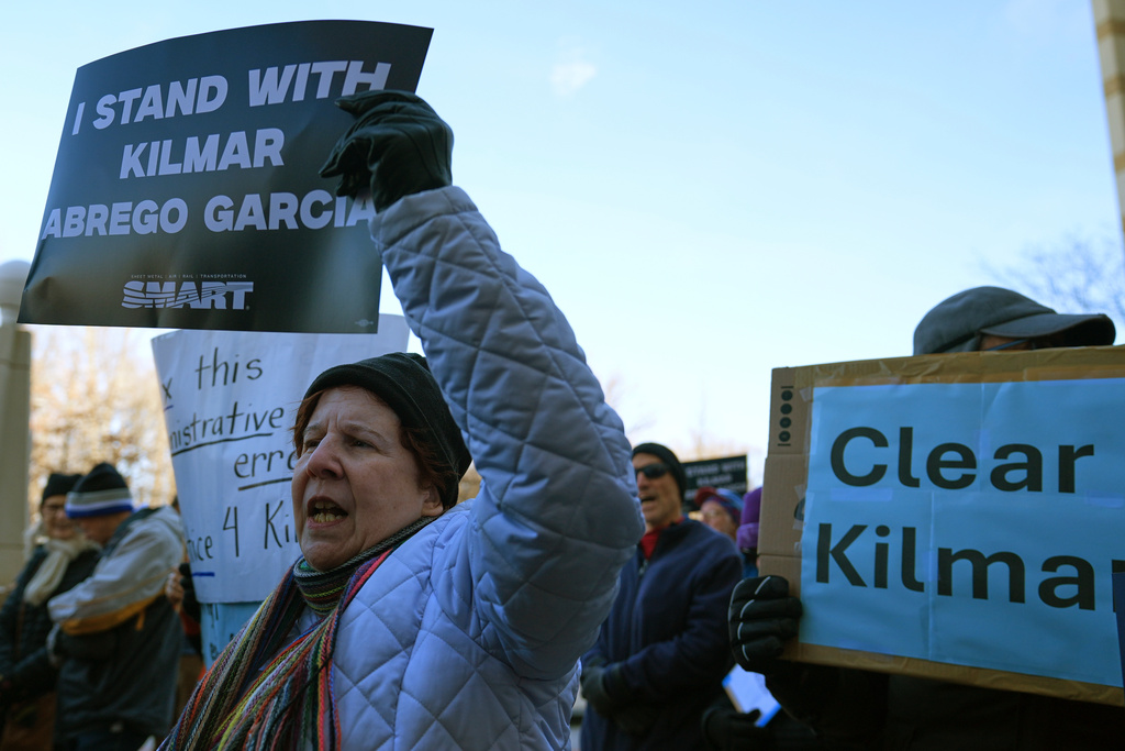 Immigrant activists rally outside of the United States District Court District of Maryland in support of Kilmar Abrego Garcia, Monday, Dec. 22, 2025, in Greenbelt, Md. (AP Photo/Stephanie Scarbrough)