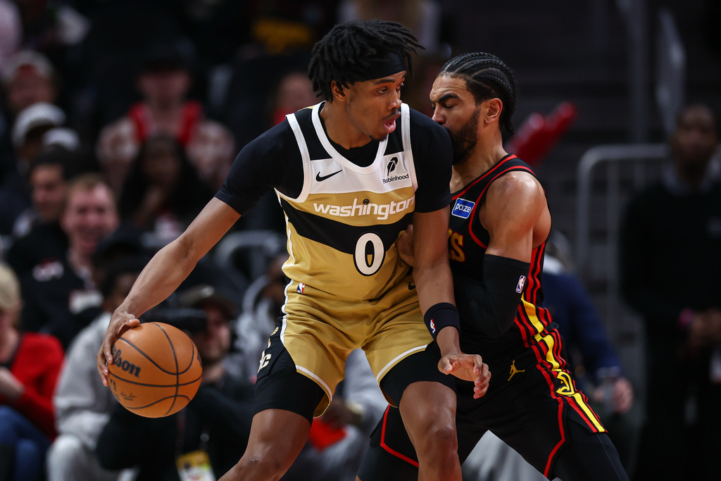 Washington Wizards guard Bilal Coulibaly (0) dribbles against Atlanta Hawks guard Gabe Vincent, right, during the first half of an NBA basketball game, Tuesday, Feb. 24, 2026, in Atlanta. (AP Photo/Colin Hubbard)