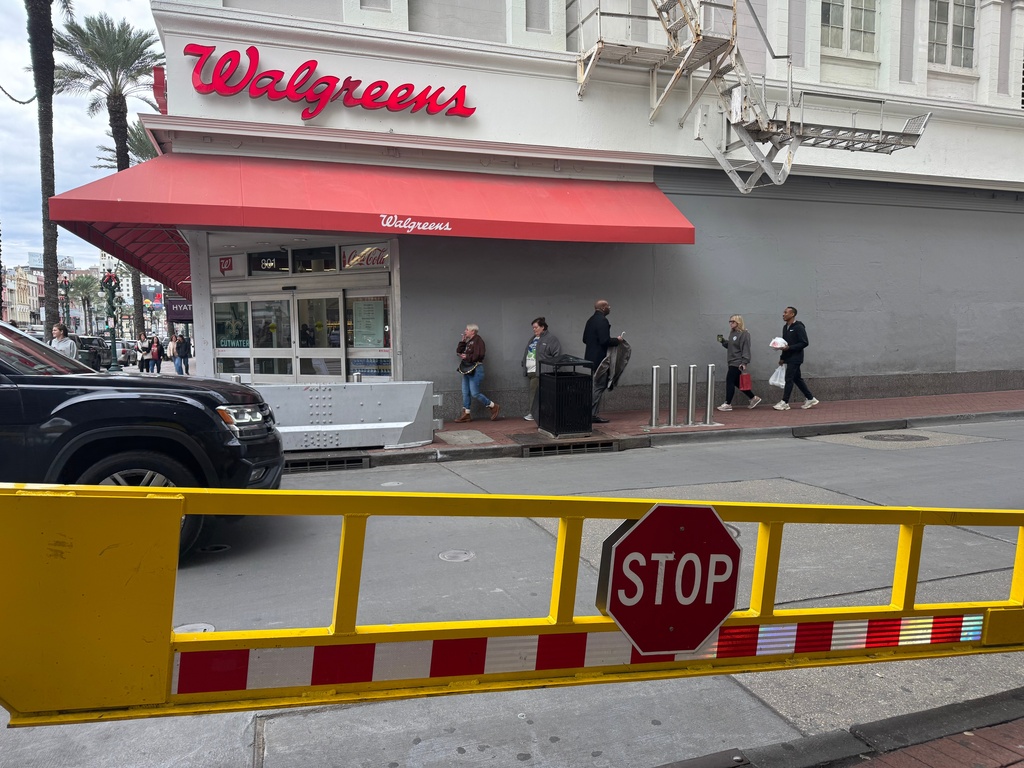 An opened gate is seen at the Bourbon Street corner in New Orleans on Monday, Dec. 29, 2025, the site of a Jan. 1, 2025, fatal vehicle ramming attack which led the city to bolster its safety measures in the area. (AP Photo/Jack Brook)