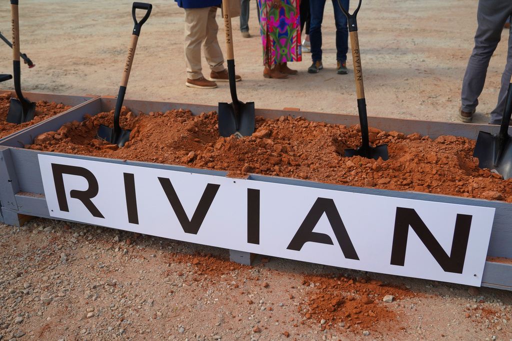Shovels stick out of a box of dirt after a groundbreaking ceremony for Rivian's future plant outside of Social Circle, Ga, on Tuesday, Sept. 16, 2025. (Matthew Pearson/WABE via AP)