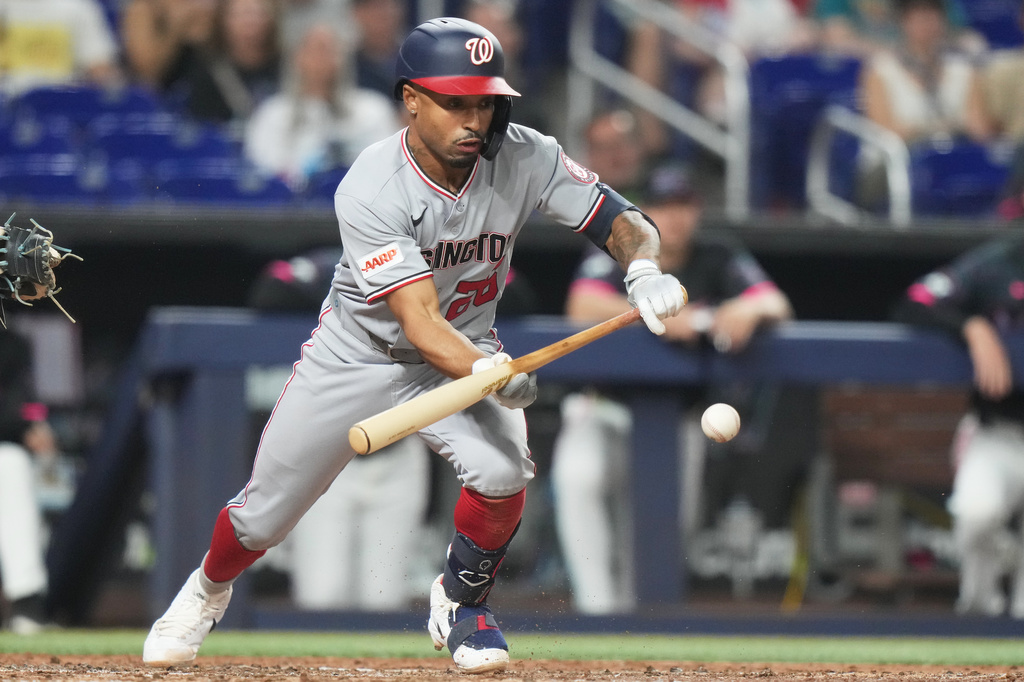 Washington Nationals' Nasim Nunez bunts on a ground out during the fourth inning of a baseball game against the Miami Marlins, Friday, May 8, 2026, in Miami. (AP Photo/Lynne Sladky)