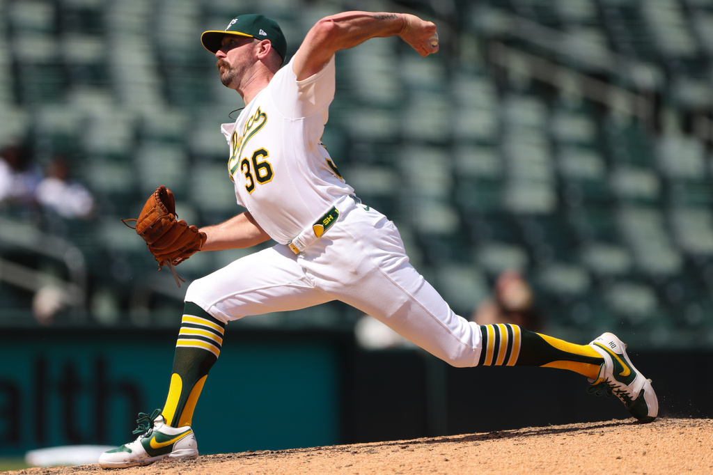 Athletics pitcher Hogan Harris throws to a Toronto Blue Jays batter during the eighth inning of a baseball game Wednesday, Sept. 9, 2026, in West Sacramento, Calif. (AP Photo/Scott Marshall)
