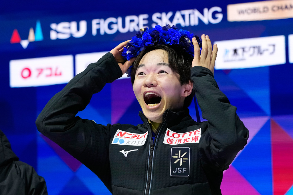 Yuma Kagiyama from Japan reacts after seeing his score during the men free skating at the Figure Skating World Championships in Prague, Czech Republic, Saturday, March 28, 2026. (AP Photo/Petr David Josek)