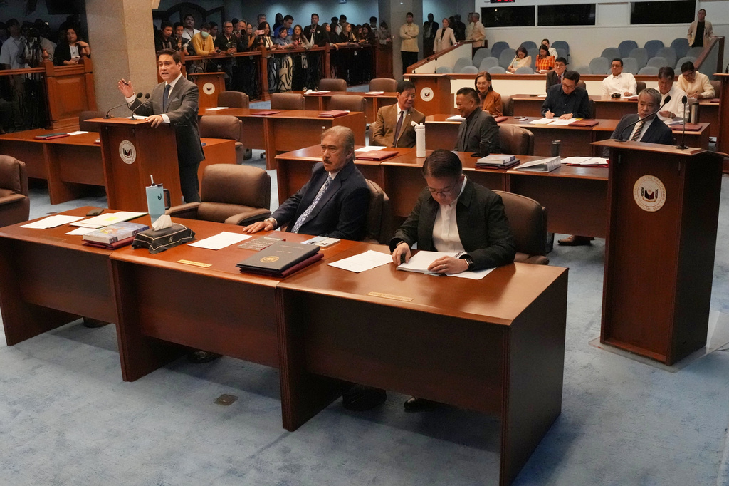 Senator Miguel Zubiri, left, speaks during a special session at the Philippine Senate in Pasay city, Philippines on Wednesday, June 17, 2026. (AP Photo/Aaron Favila)