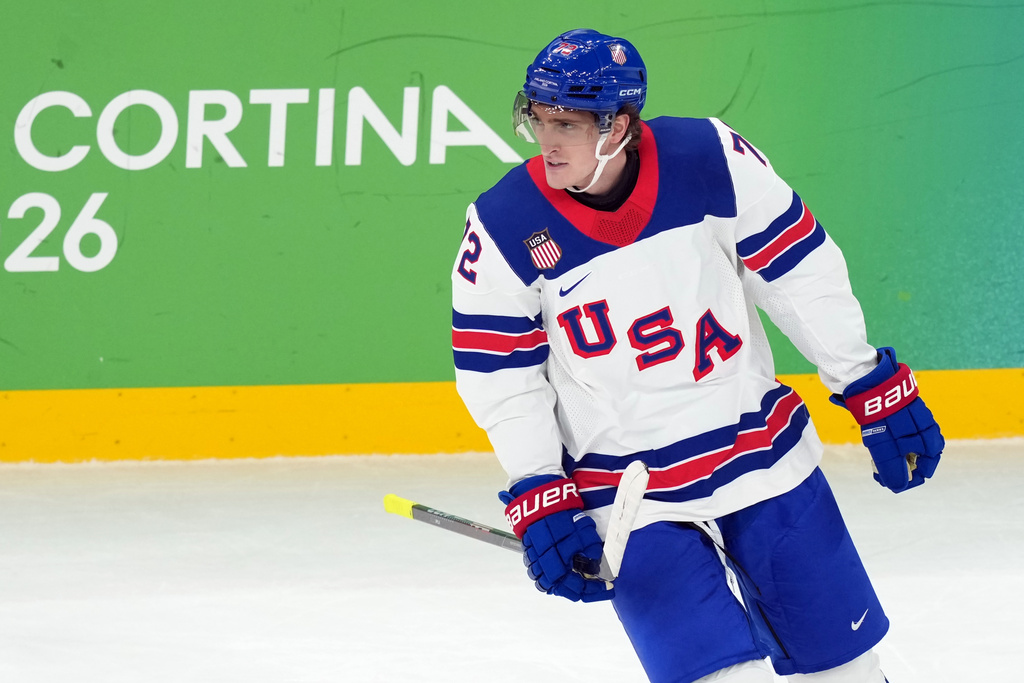 United States' Tage Thompson skates past the bench after scoring a goal against Slovakia during the first period of a men's ice hockey semifinal game at the 2026 Winter Olympics in Milan, Italy, Friday, Feb. 20, 2026. (AP Photo/Carolyn Kaster)
