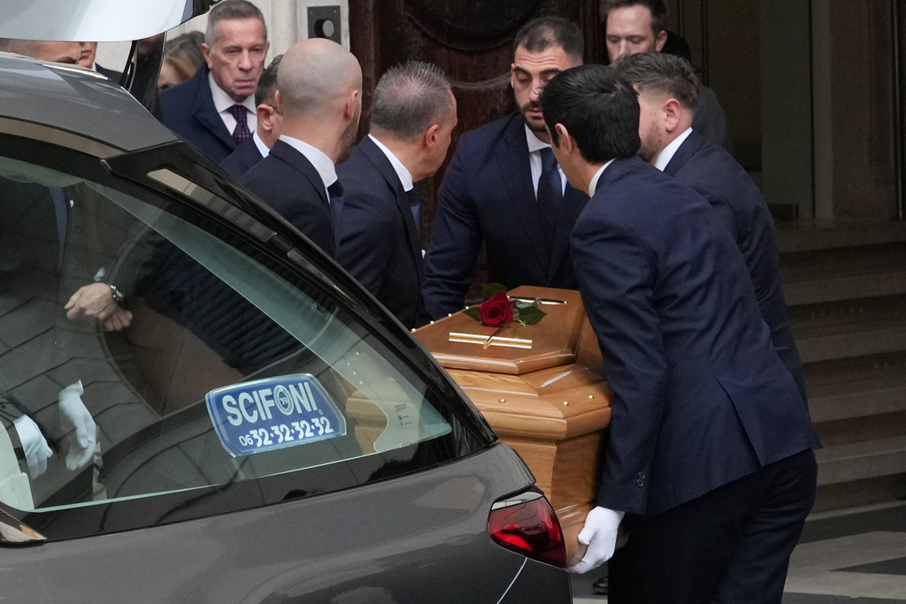 The coffin of fashion designer Valentino Garavani arrives for the lying in state at the Valentino Garavani and Giancarlo Giammetti foundation headquarters in central Rome, Wednesday Jan. 21, 2026. (AP Photo/Andrew Medichini)