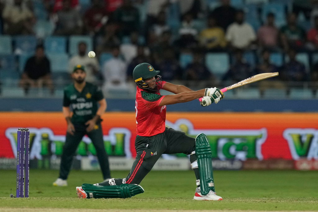 Bangladesh's Rishad Hossain plays a shot during the Asia Cup cricket match between Bangladesh and Pakistan at Dubai International Cricket stadium in Dubai, United Arab Emirates, Thursday, Sept. 25, 2025. (AP Photo/Altaf Qadri)