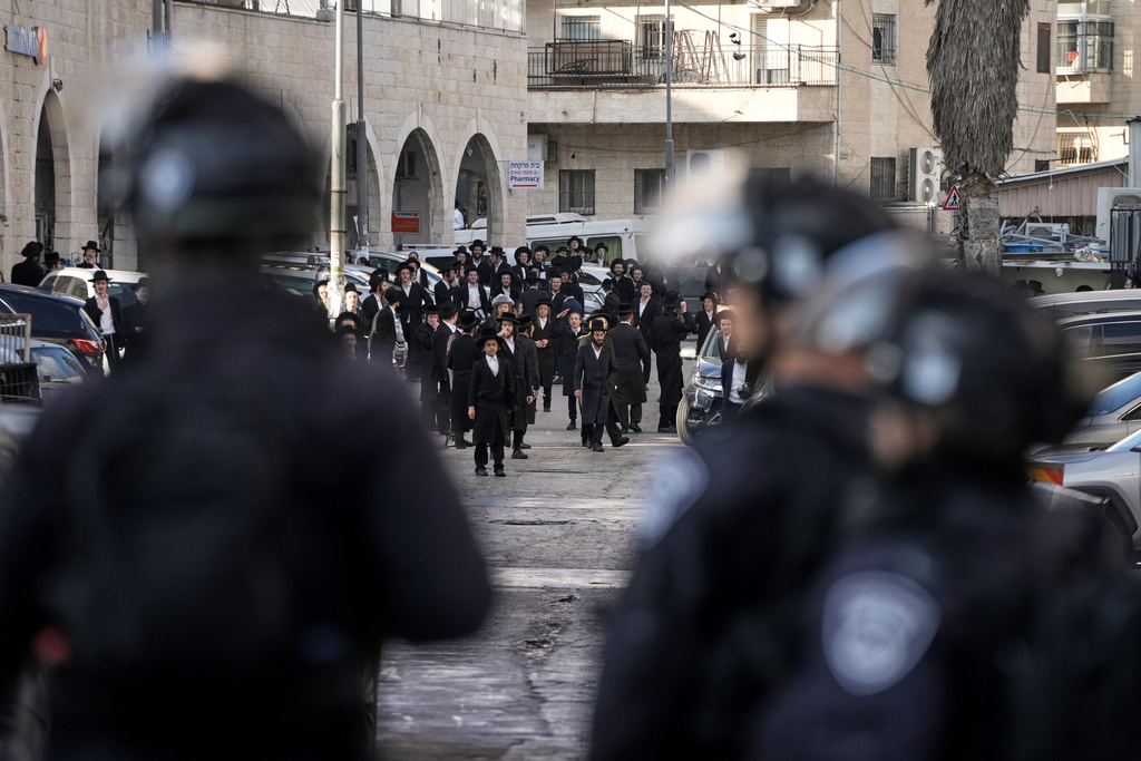 Ultra Orthodox protesters clash with Israeli police during a violent disturbance in Jerusalem, Thursday, Dec. 18, 2025. (AP Photo/ Mahmoud Illean)