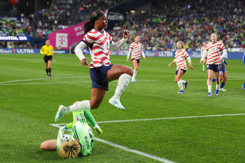 Japan goalkeeper Akane Okuma collects the ball against United States midfielder Jaedyn Shaw during the first half of an international friendly soccer match Tuesday, April 14, 2026, in Seattle. (AP Photo/Lindsey Wasson)