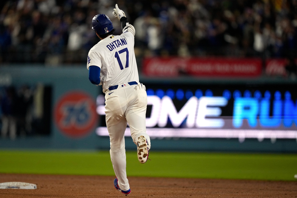 Los Angeles Dodgers' Shohei Ohtani gestures as he rounds second after hitting a solo home run during the sixth inning of a baseball game against the Tampa Bay Rays, Tuesday, June 16, 2026, in Los Angeles. (AP Photo/Mark J. Terrill)