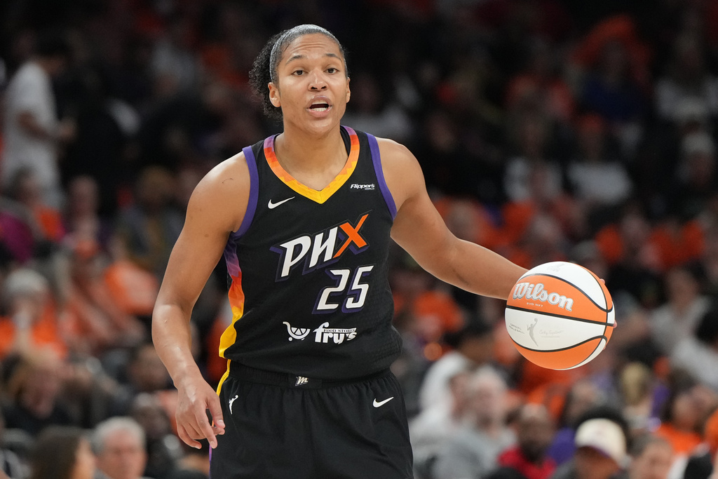 FILE - Phoenix Mercury forward Alyssa Thomas (25) drives against the Las Vegas Aces during the first half of Game 3 of the WNBA basketball finals, Wednesday, Oct. 8, 2025, in Phoenix. (AP Photo/Rick Scuteri, File)