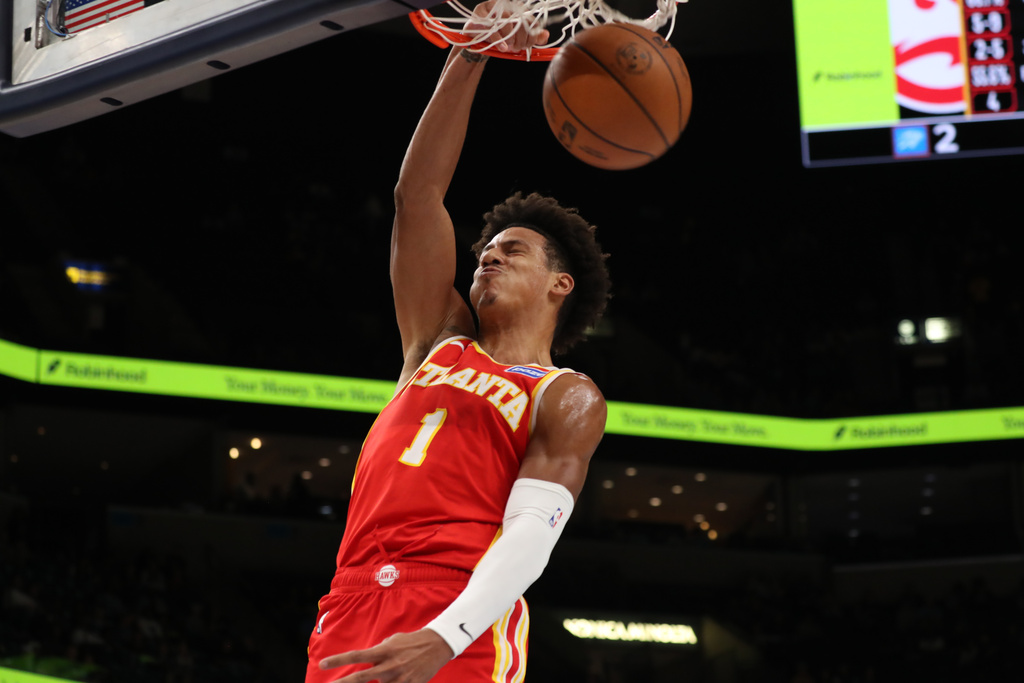 Atlanta Hawks forward Jalen Johnson dunks in the first half of a preseason NBA basketball game against the Memphis Grizzlies, Saturday, Oct. 11, 2025, in Memphis, Tenn. (AP Photo/Nikki Boertman)