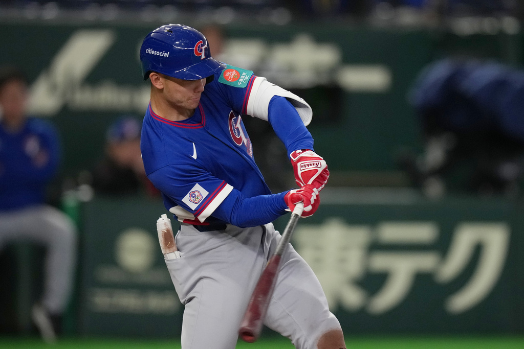 Taiwan's Stuart Fairchild hits a grand slam home run in the second inning of a World Baseball Classic game between Taiwan and Czechia in Tokyo, Saturday, March 7, 2026. (AP Photo/Hiro Komae)