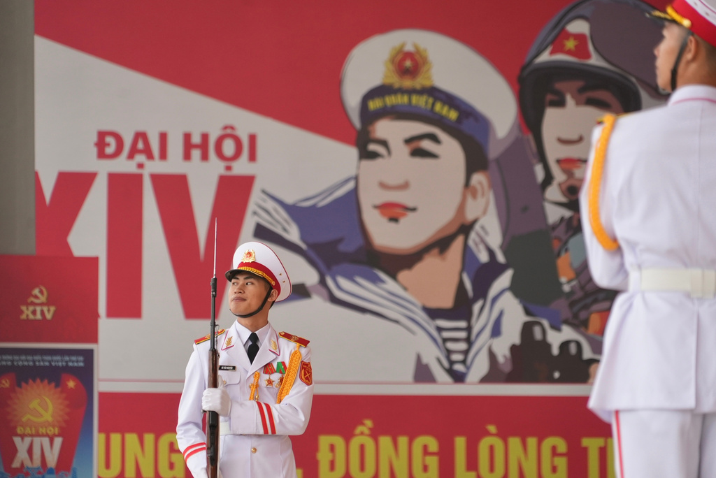 Honor guards salute the arrival of delegation at the National Convention Center for the week-long Congress of the Communist Party of Vietnam in Hanoi, Vietnam, Monday, Jan. 19, 2026. (AP Photo/Hau Dinh)