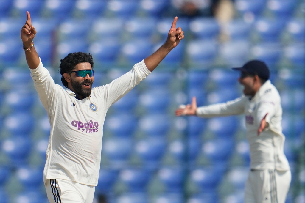 India's Ravindra Jadeja, left, celebrates the dismissal of West Indies' John Campbell with his teammates on the fourth day of the second cricket test match between India and West Indies at the Arun Jaitley Stadium in New Delhi, India, Monday, Oct.13, 2025. (AP Photo/Manish Swarup)