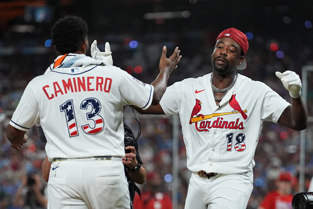 Tampa Bay Rays' Junior Caminero, left, greets St. Louis Cardinals' Jordan Walker during the MLB baseball All-Star Home Run Derby, Monday, July 13, 2026, in Philadelphia. (AP Photo/Matt Rourke)