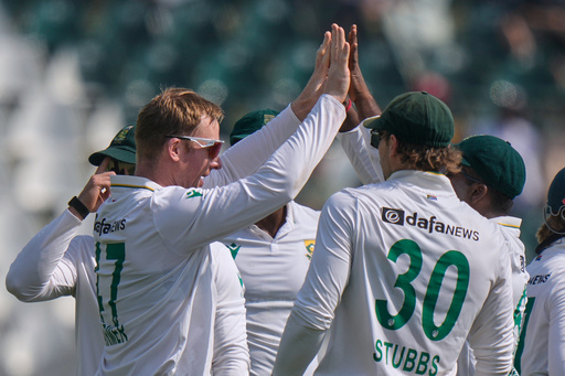 South Africa's Simon Harmer, left, celebrates with teammates after taking the wicket of Pakistan's Imam-ul-Haq during the first day of the second test cricket match between Pakistan and South Africa, at the Rawalpindi Cricket Stadium, in Rawalpindi, Pakistan, Monday, Oct. 20, 2025. (AP Photo/Anjum Naveed) South Africa's Simon Harmer, left, celebrates with teammates after taking the wicket of Pakistan's Imam-ul-Haq during the first day of the second test cricket match between Pakistan and South Africa, at the Rawalpindi Cricket Stadium, in Rawalpindi, Pakistan, Monday, Oct. 20, 2025. (AP Photo/Anjum Naveed)