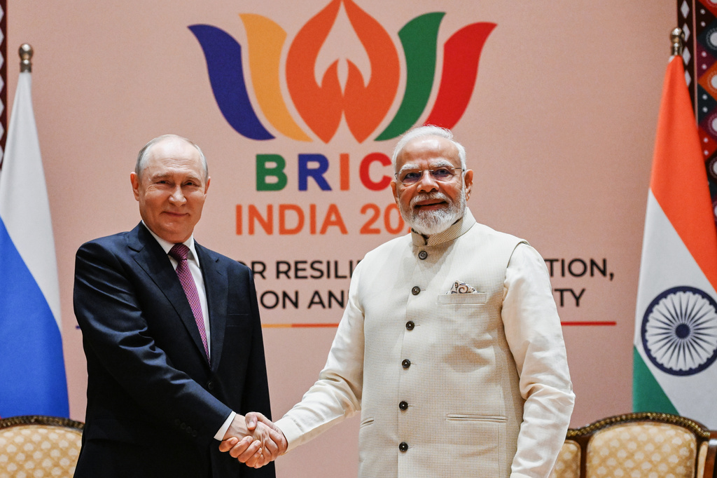 Russian President Vladimir Putin, left, and Indian Prime Minister Narendra Modi pose for a photo during their meeting on the sidelines of the BRICS Summit in New Delhi, India, on Friday, Sept. 11, 2026. (Kristina Solovyova, Sputnik, Kremlin Pool Photo via AP)