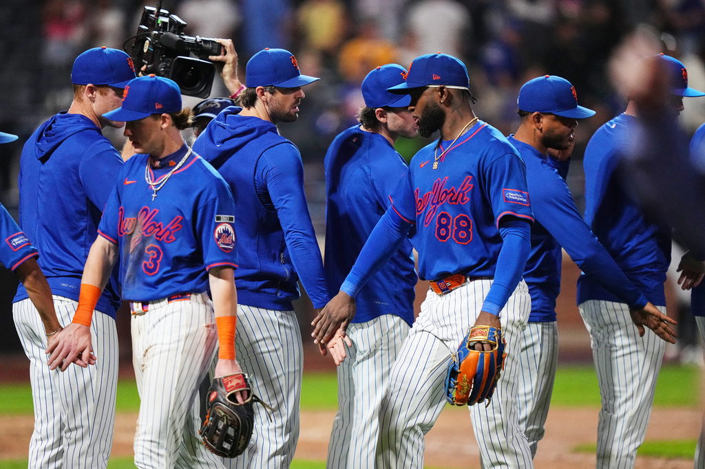 New York Mets' Luis Robert Jr. (88) celebrates with teammates after a baseball game Miami Marlins Thursday, July 30, 2026, in New York. (AP Photo/Frank Franklin II)