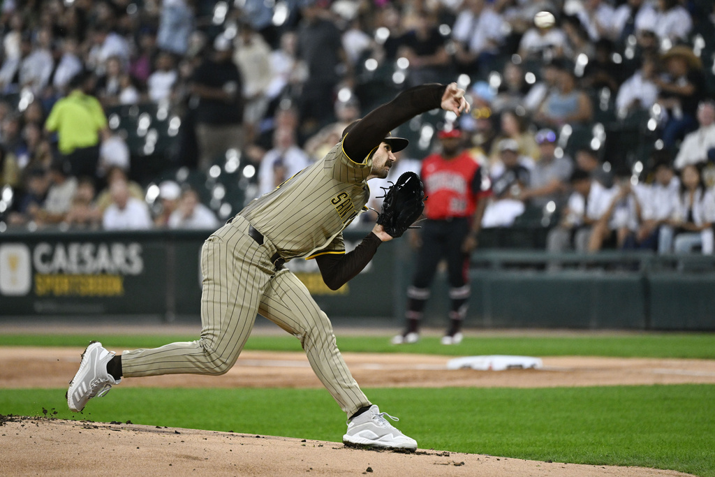 San Diego Padres pitcher Dylan Cease delivers during the first inning of a baseball game against the Chicago White Sox, Friday, Sept. 19, 2025, in Chicago. (AP Photo/Matt Marton)