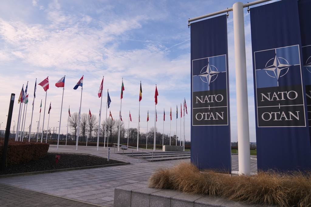 FILE - Flags flap in the wind outside NATO headquarters in Brussels, Jan. 19, 2026. (AP Photo/Virginia Mayo, File)