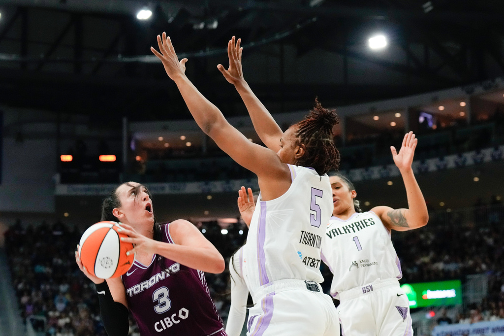 Toronto Tempo guard Marina Mabrey (3) shoots against Golden State Valkyries forward Kayla Thornton (5) during the first half of a WNBA basketball game in Toronto on Wednesday, July 8, 2026. (Chris Young/The Canadian Press via AP)