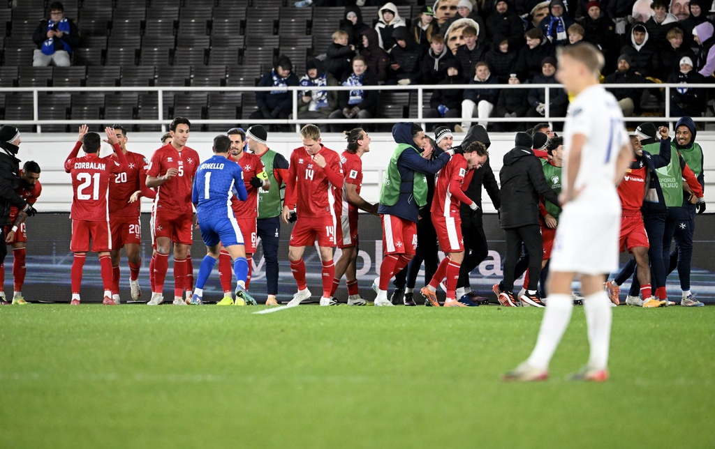 Players of Malta celebrate a goal by Jake Grech during the FIFA World Cup 2026 Group G qualifying soccer match between Finland and Malta in Helsinki, Finland, Friday, Nov. 14, 2025. (Heikki Saukkomaa/Lehtikuva via AP)
