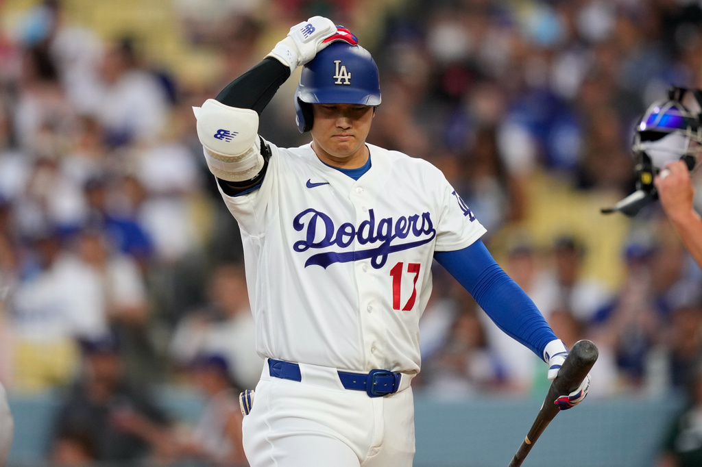 Los Angeles Dodgers' Shohei Ohtani walks back to the dugout after striking out as during the third inning of a baseball game against the Cincinnati Reds, Monday, Sept. 7, 2026, in Los Angeles. (AP Photo/Mark J. Terrill)