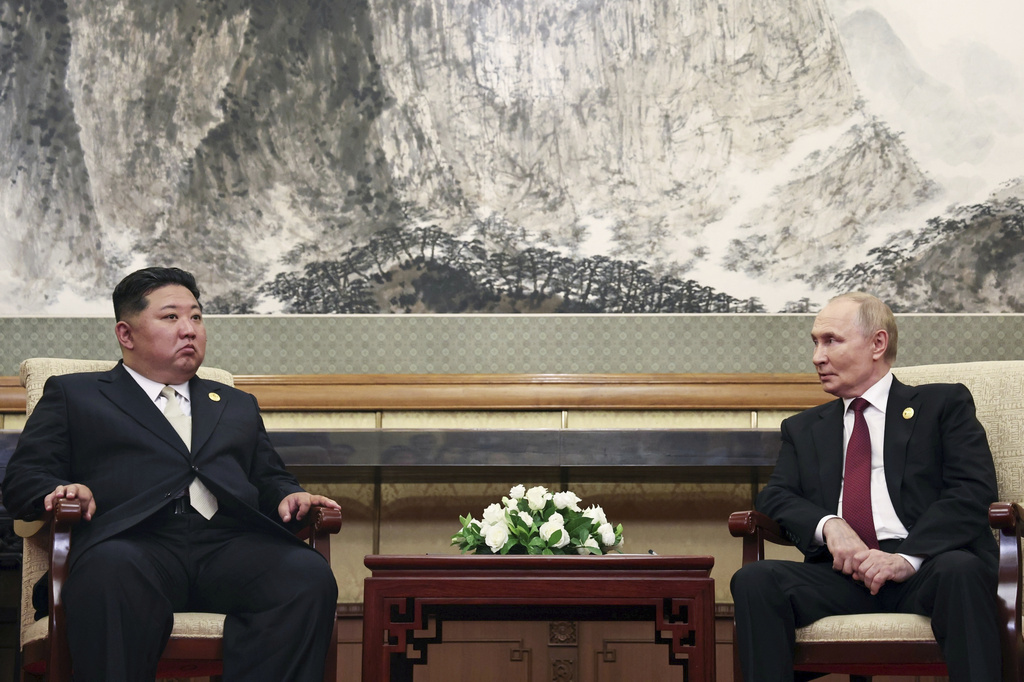 Russian President Vladimir Putin, right, speaks with North Korean leader Kim Jong Un during their meeting at Diaoyutai State Guesthouse in Beijing, China, Wednesday, Sept. 3, 2025. (Alexander Kazakov, Sputnik, Kremlin Pool Photo via AP)