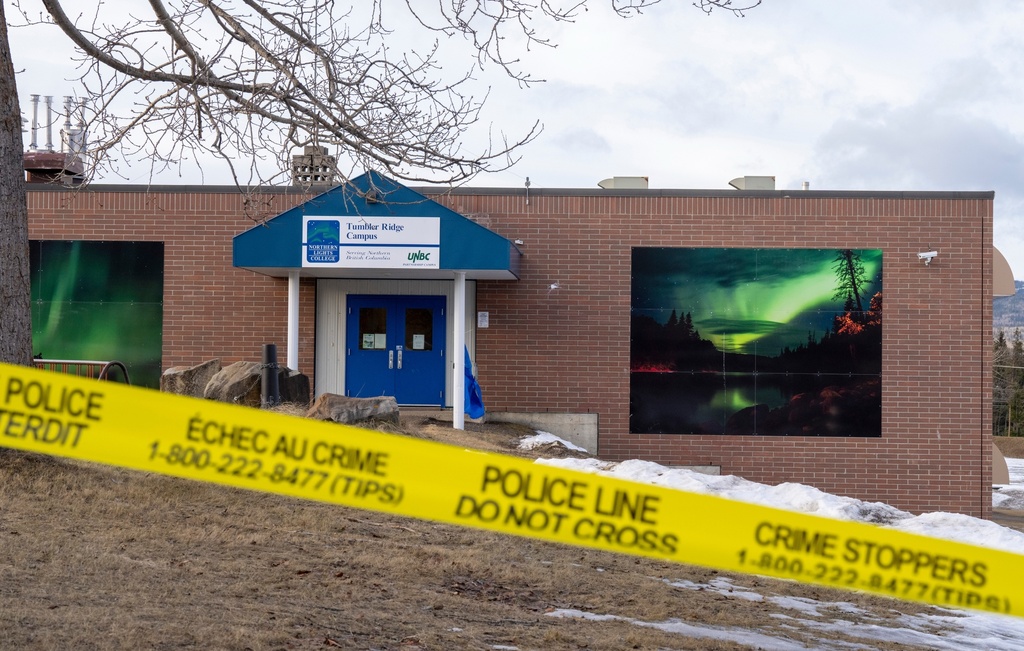 FILE - Police tape surrounds a school in Tumbler Ridge, British Columbia, Canada, Feb. 12, 2026, two days after a mass shooting. (Christinne Muschi/The Canadian Press via AP, File)