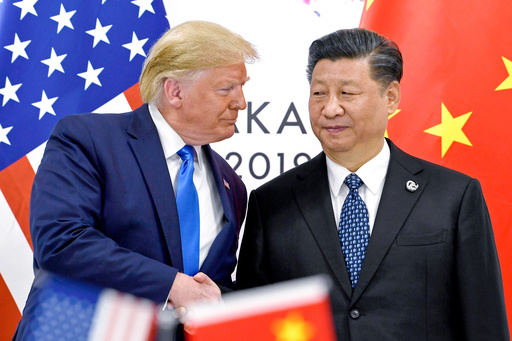 FILE - President Donald Trump, left, shakes hands with China's President Xi Jinping during a meeting on the sidelines of the G-20 summit in Osaka, Japan, June 29, 2019. (AP Photo/Susan Walsh, File) FILE - President Donald Trump, left, shakes hands with China's President Xi Jinping during a meeting on the sidelines of the G-20 summit in Osaka, Japan, June 29, 2019. (AP Photo/Susan Walsh, File)