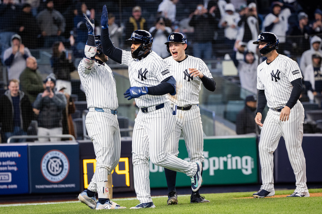New York Yankees third baseman Amed Rosario (14) scores a three-run home run during the eighth inning of a baseball game against the Athletics, Tuesday, April 7, 2026, in New York. (AP Photo/Angelina Katsanis)
