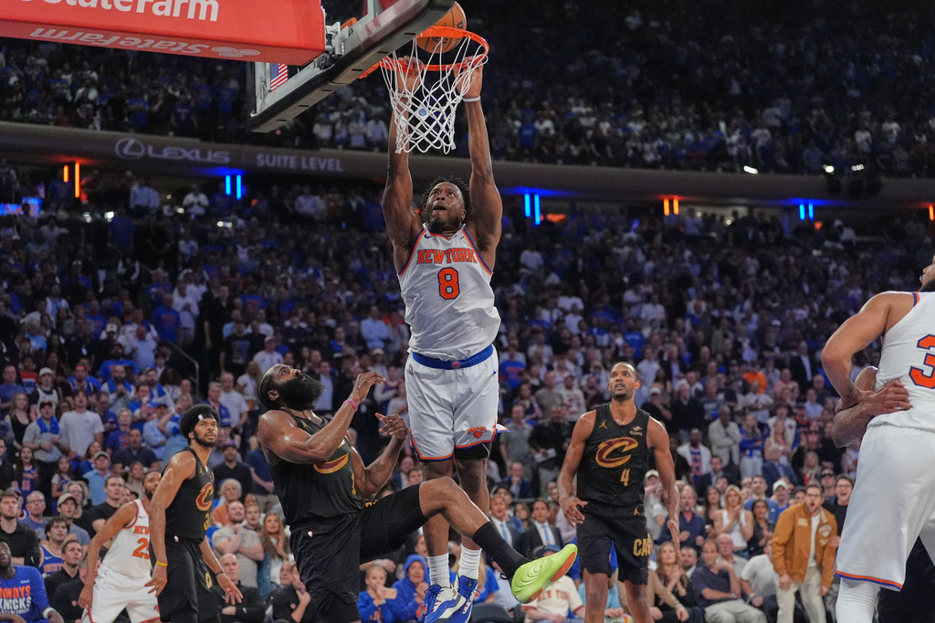 Cleveland Cavaliers' James Harden, bottom left, fouls New York Knicks' Og Anunoby during the overtime period of Game 1 in the Eastern Conference finals NBA basketball playoffs series Tuesday, May 19, 2026, in New York. (AP Photo/Seth Wenig)