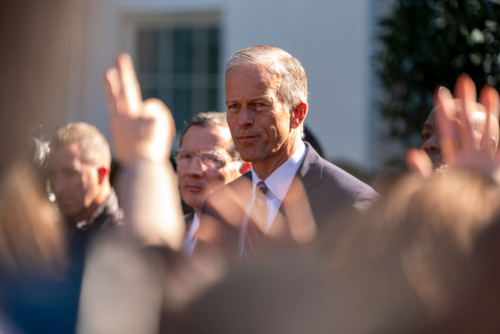 Senate Majority Leader John Thune, of S.D., center, and other republican Senate members, speak with reporters after a meeting with President Donald Trump at the White House, Tuesday, Oct. 21, 2025, in Washington. (AP Photo/Alex Brandon)