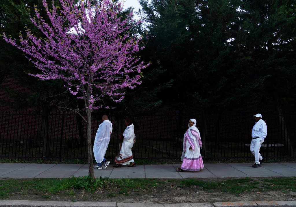 Congregants walk to Re'ese Adbarat Debre Selam Kidist Mariam Church, an Ethiopian Orthodox Tewahedo church, for Easter service, in Washington, Saturday, April 11, 2026. (AP Photo/Jessie Wardarski)