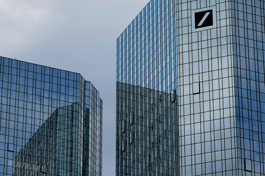 FILE - The logo of Deutsche Bank is seen on the bank's headquarters in Frankfurt, Germany, April 16, 2025. (AP Photo/Matthias Schrader, File)