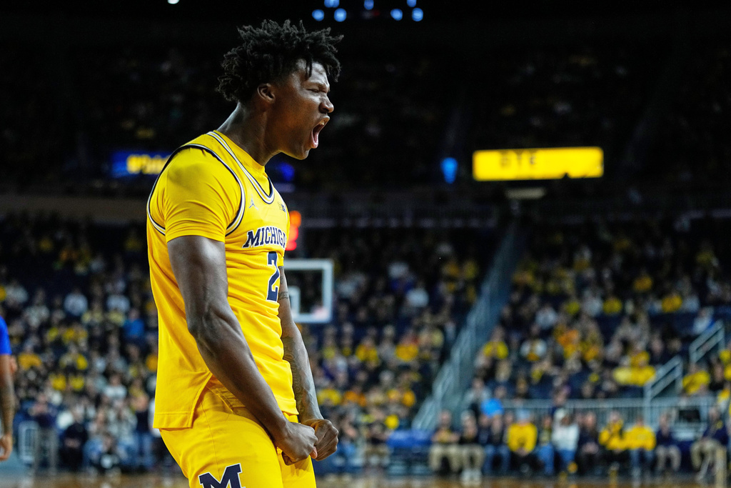 Michigan guard L.J. Cason reacts after drawing an and-one foul during the first half of an NCAA college basketball game against McNeese, Monday, Dec. 29, 2025, in Ann Arbor, Mich. (AP Photo/Ryan Sun)