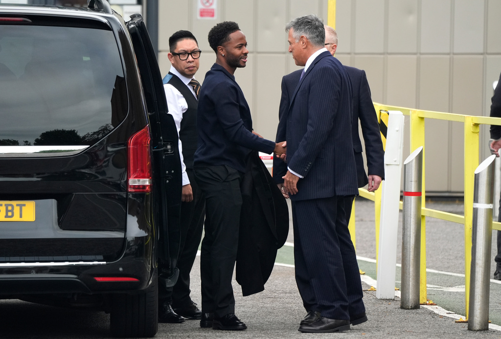 Former England soccer player Raheem Sterling, second left, arrives at Basingstoke Magistrates' Court ahead of his first appearance accused of dangerous driving in Hampshire, England, Tuesday, Sept. 15, 2026. (Andrew Matthews/PA via AP)