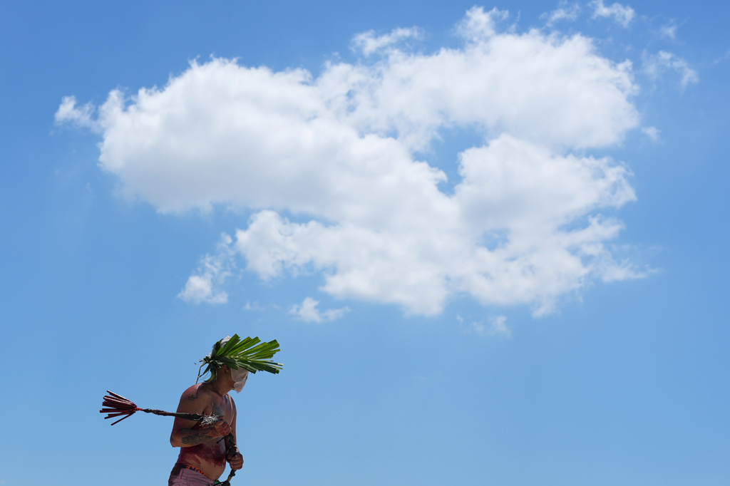 A flagellant walks the streets during Good Friday rituals in San Pedro Cutud village, Pampanga province, northern Philippines, Friday April 3, 2026. (AP Photo/Aaron Favila)
