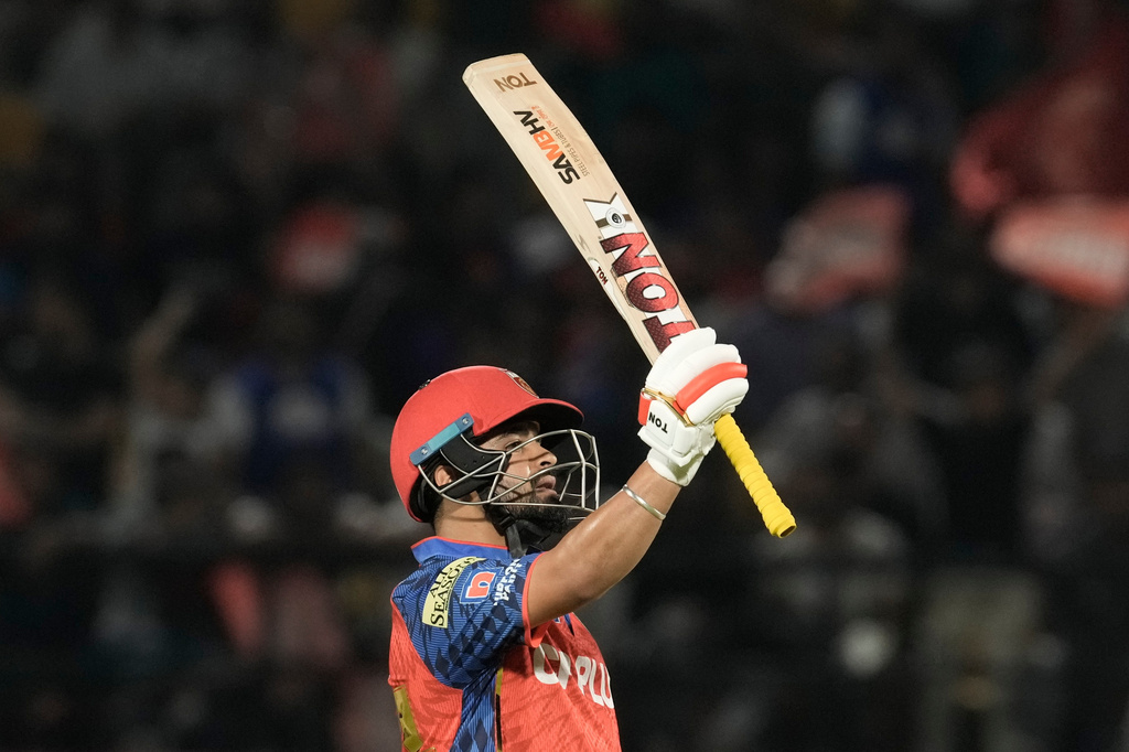 Punjab Kings' Prabhsimran Singh celebrates scoring his fifty runs during the Indian Premier League cricket match between Punjab Kings and Mumbai Indians in Dharamshala, India, Thursday, May 14, 2026. (AP Photo/Ashwini Bhatia)