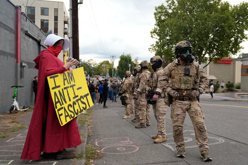 Customs and Border Protection agents standoff against demonstrators outside a U.S. Immigration and Customs Enforcement facility during a protest on Saturday, Oct. 4, 2025, in Portland, Ore. (AP Photo/Jenny Kane) Customs and Border Protection agents standoff against demonstrators outside a U.S. Immigration and Customs Enforcement facility during a protest on Saturday, Oct. 4, 2025, in Portland, Ore. (AP Photo/Jenny Kane)